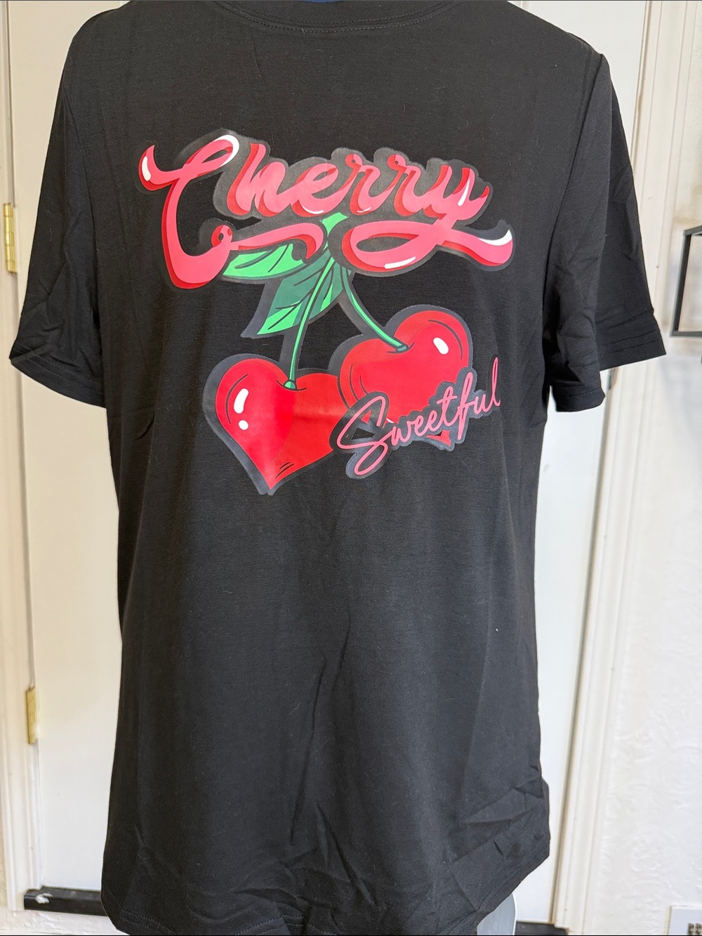 Amazon Black Tee with Red Cherry Graphic and Green Leaves
